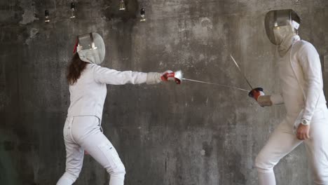 two fencers in action