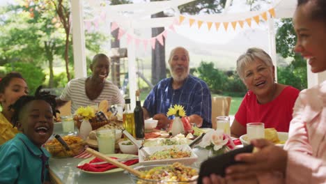 Multi-generation-African-American-family-spending-time-in-garden-together