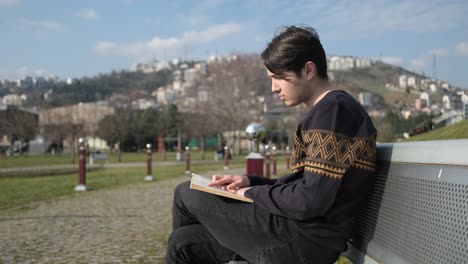 young man reading book