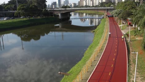 bike path beside polluted pinheiros river in sao paulo city, brazil