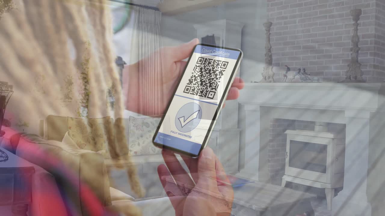 Animation of woman holding smartphone with covid 19 vaccination passport over living room