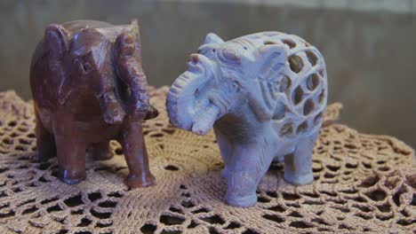 close up of two souvenir elephants on the table