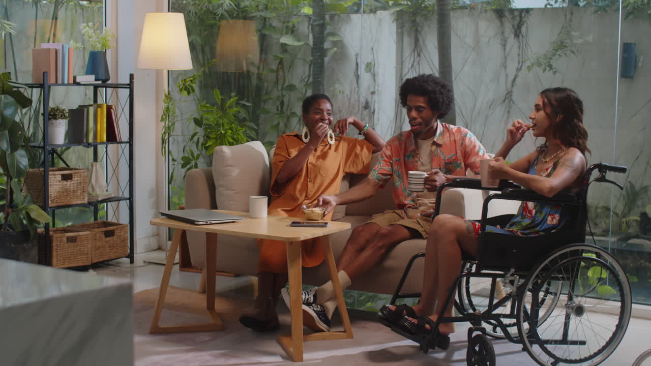 Diverse Friends Eating Snacks and Communicating at Home