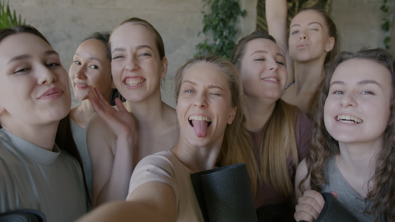 Happy Women Taking a Group Selfie After Yoga Class