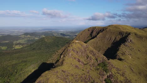 slow aerial orbit around pelado peak after sunrise in 4k