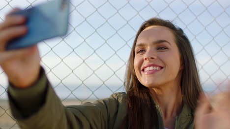 a happy young woman waving