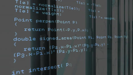 Computer code animation over glass windows in modern office building