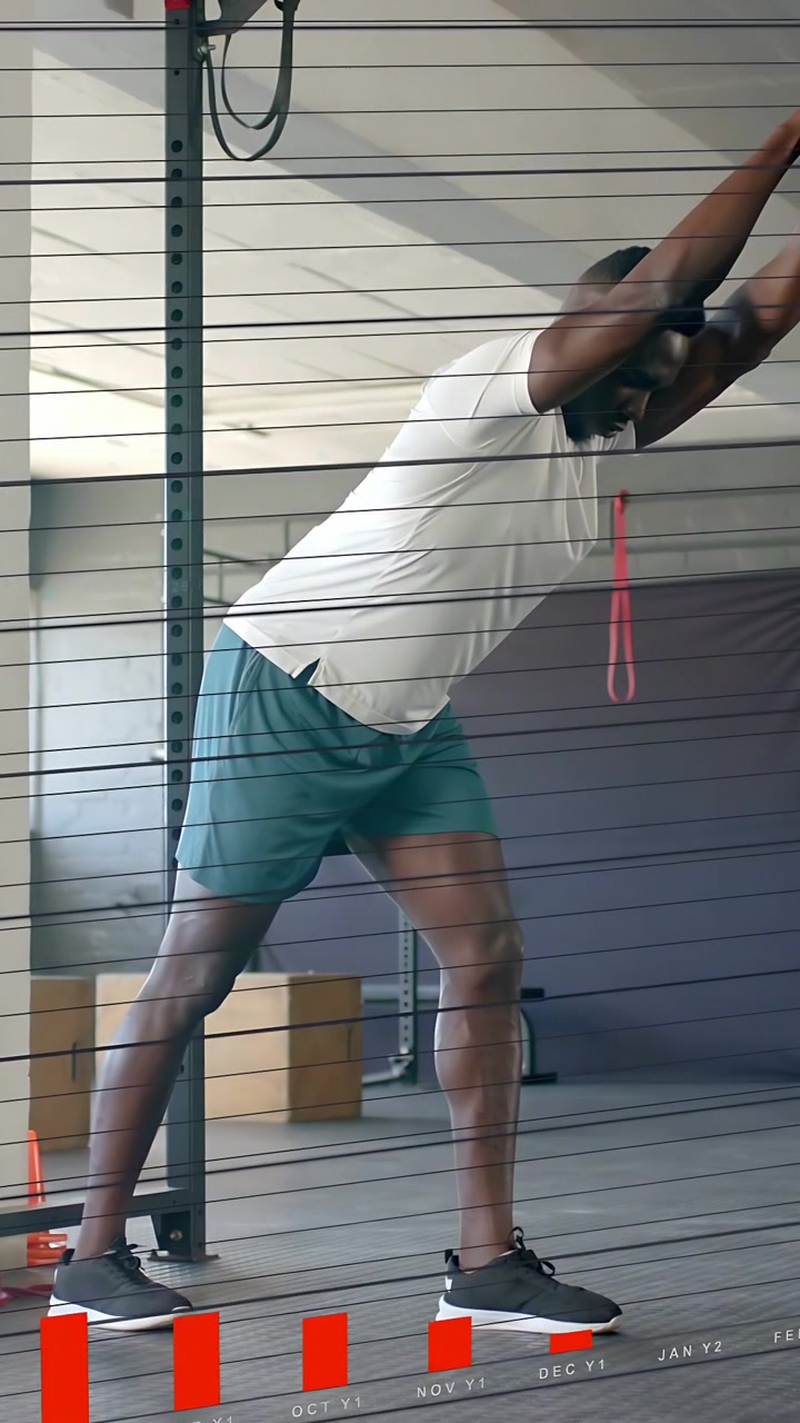 Vertical video: Man leaning on rig then walking, causing rising fitness overlays while warming up