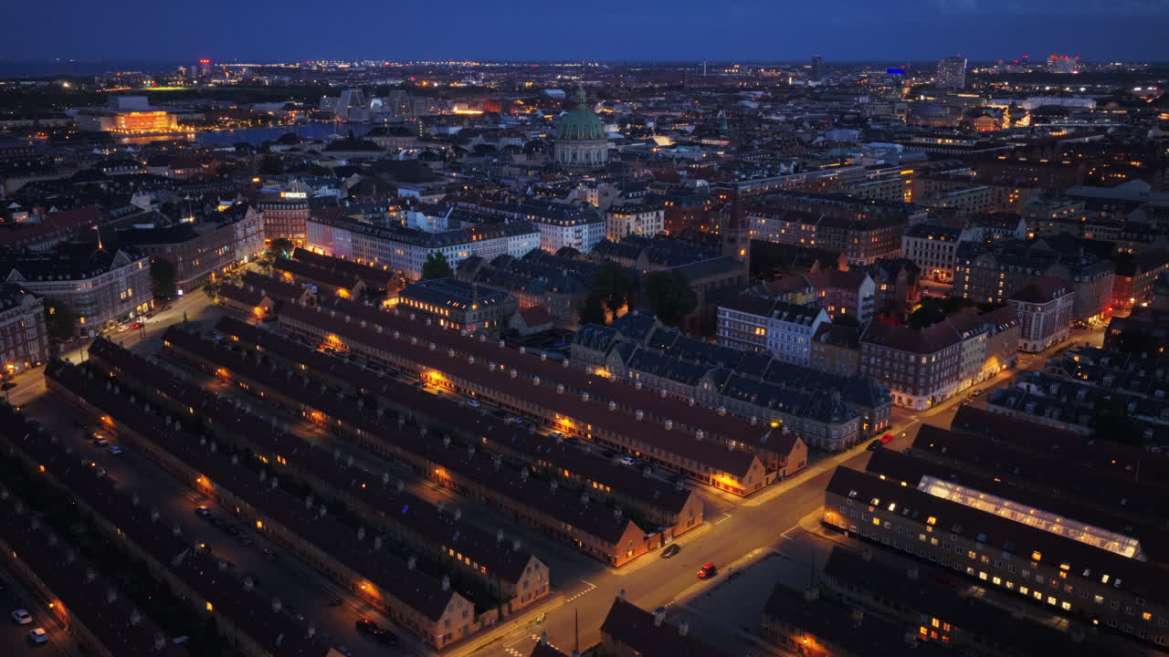 Aerial drone view over the historic Nyboder houses with Frederiks Church visible, in Copenhagen, Denmark