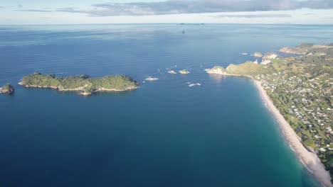 offshore islands near hahei beach town on coromandel peninsula coast in mercury bay, north island, new zealand