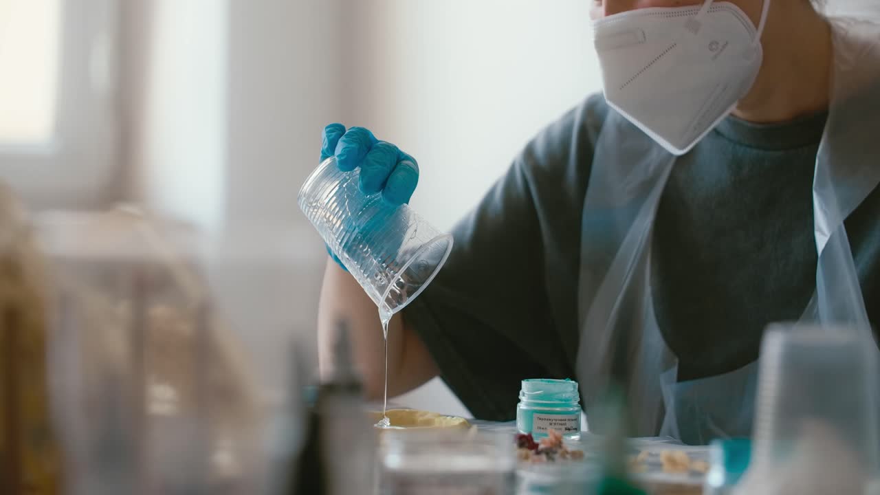 Person Pouring Resin in a Craft Project