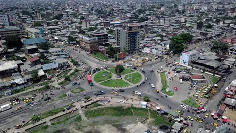 aerial view circling around traffic at the rond-point deido in douala city, in sunny cameroon, africa