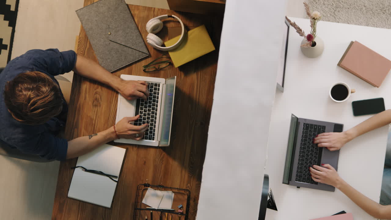 Top View of Neighbors Working on Laptops in Apartments