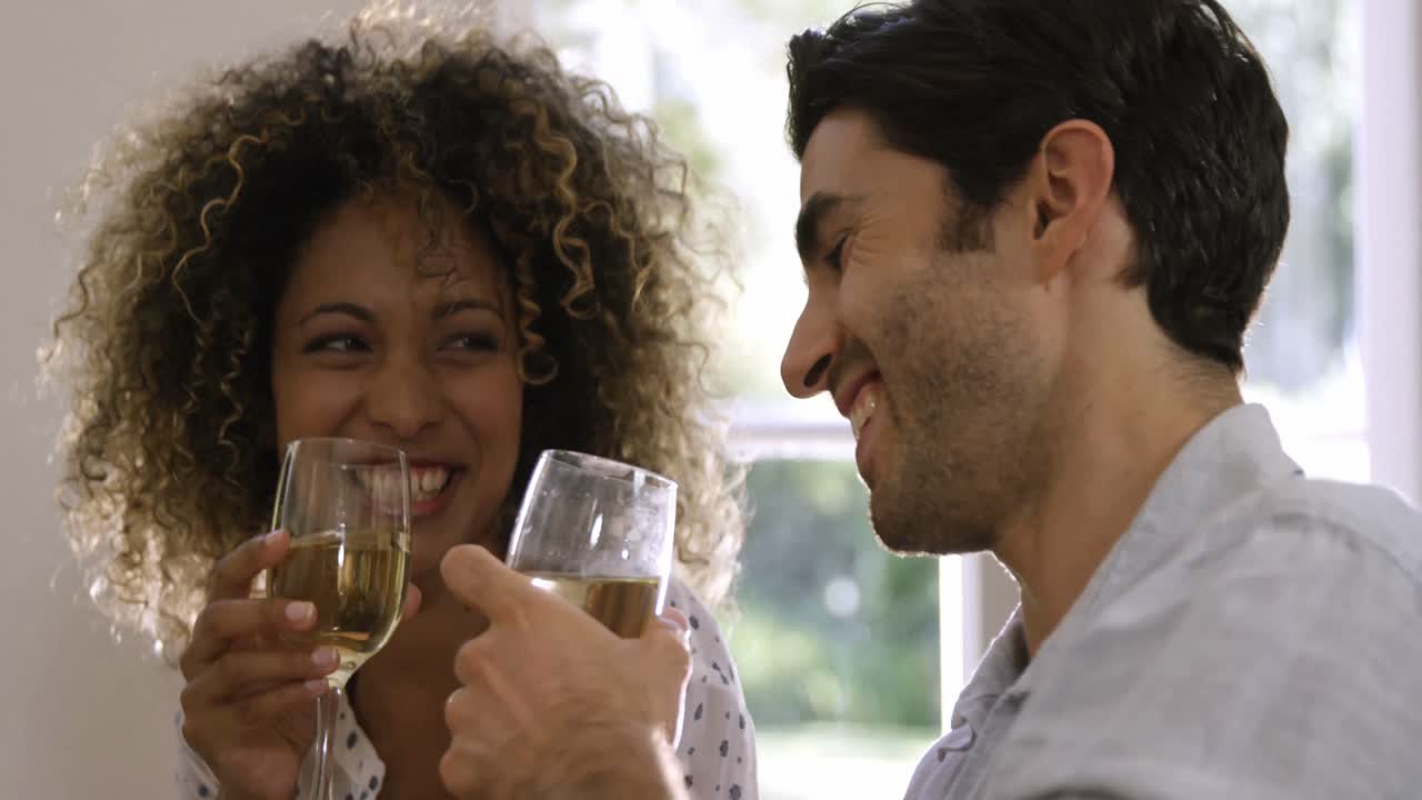 Happy couple having wine