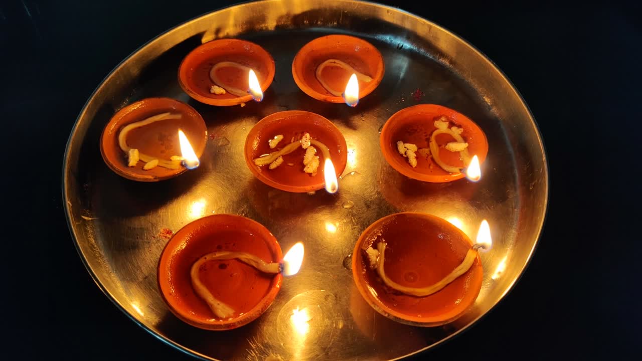 Decorated Diwali Lamps lit in a plate on the special occasion of Diwali