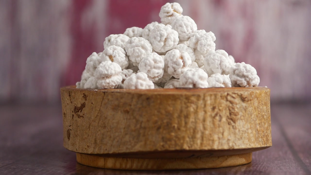 White Sugar-Coated Chickpeas in a Rustic Wooden Bowl