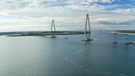 drone orbits left beside cooper river bridge in charleston south carolina