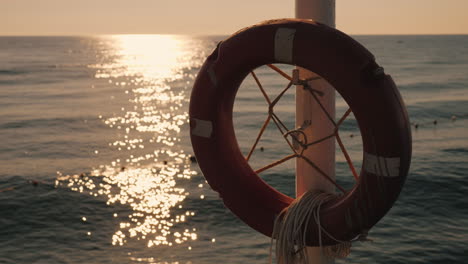 Lifebuoy-Near-The-Sea-Early-Morning-The-Sun-Has-Just-Risen-4k-Video