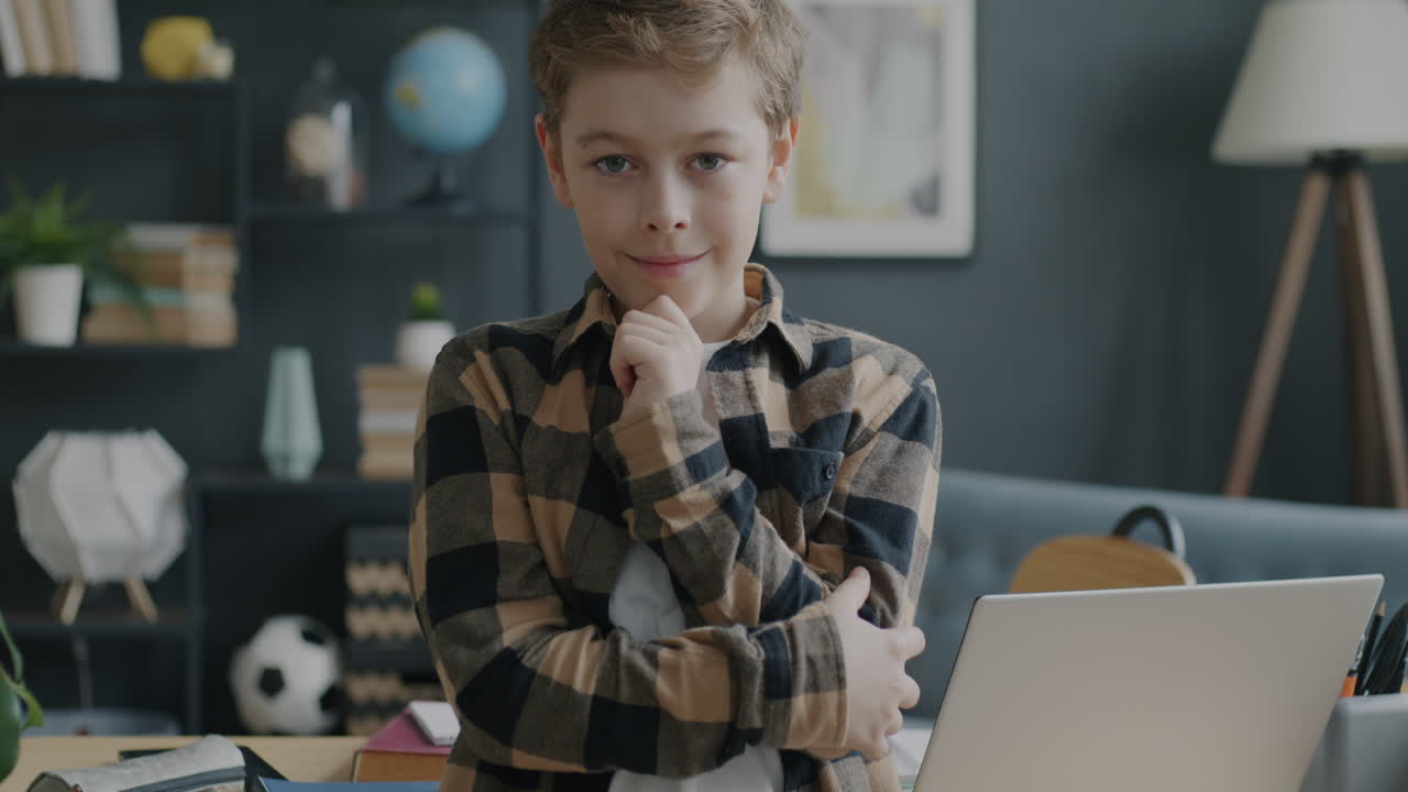 Thoughtful Boy at Laptop