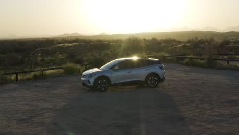 electric car glistening in the sonoran desert, panoramic shot