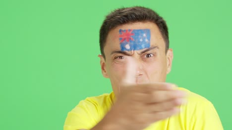 man with australian national flag upset with a referee