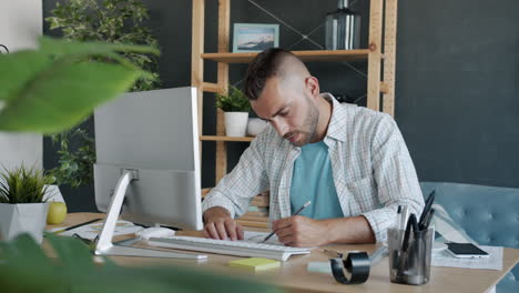 man working on design project at home office