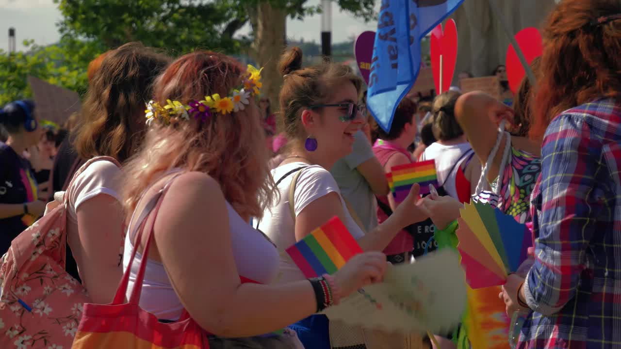 Colorful people getting ready to march in the Budapest Pride, Lady with flower crown,