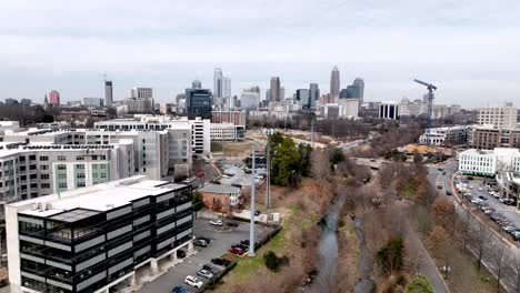 charlotte nc, north carolina skyline with cell phone tower in foreground