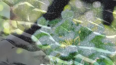 green leaves and white dots animation creating nature-inspired abstract pattern