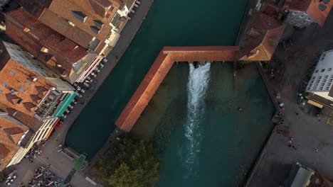 covered bridge and sluice of aare river in historic thun town center