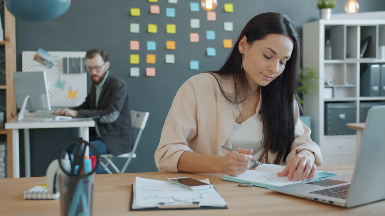 Woman taking notes in a modern office