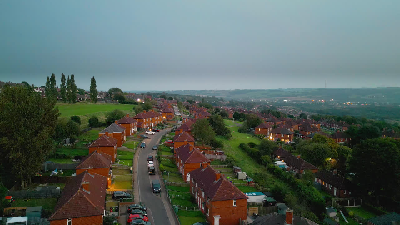 Explore the famed Dewsbury Moore Council estate in the UK through drone-captured video, showcasing urban council-owned housing, red-brick terraced homes, and the industrial Yorkshire backdrop