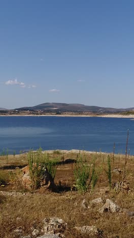 blue lake and blue sky vertical video