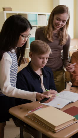 students collaborating on a school assignment