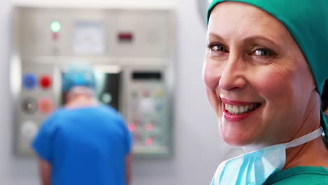 Female-nurse-in-surgical-cap-at-operation-theater