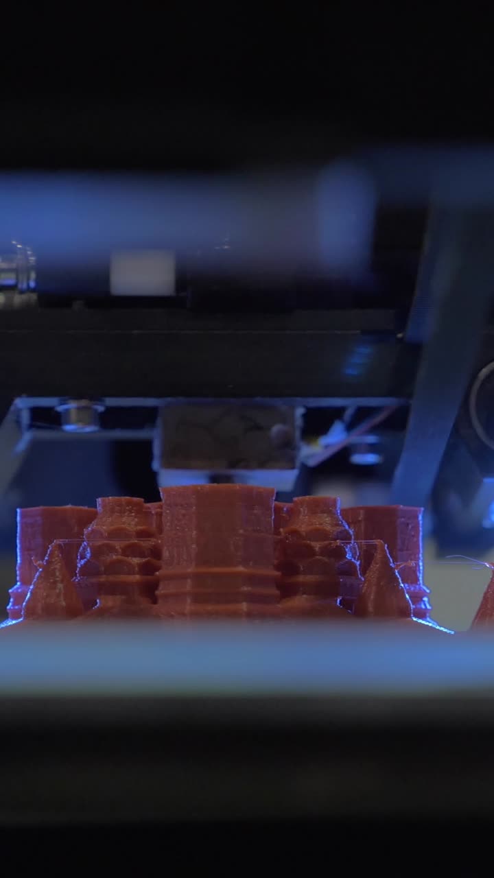 Close-up of a 3D Printer Creating a Red Object