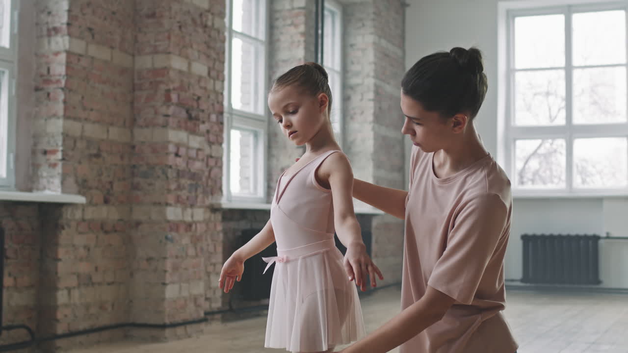 Little Girl Learning Ballet Dance With Trainer