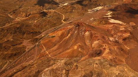 flying above the hot desert divided by highway. mojave desert from aerial view in california, usa.