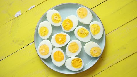 Boiled-chicken-eggs-on-a-blue-ceramic-plate--The-concept-of-Easter-Holidays