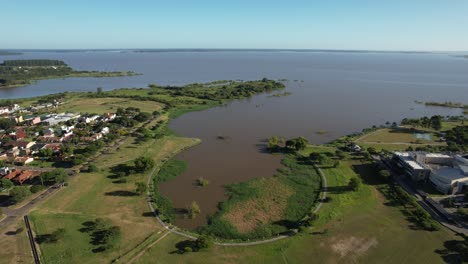beautiful tourist spot in the city of federación, in argentina, filmed with a drone lowering under the horseshoe next to the salto grande dam, strong contrasting light