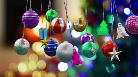 animation of christmas baubles over christmas tree background