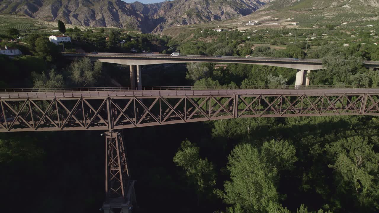 Steel bridge and concrete bridge. Aerial view. Comparative aerial view of civil structures. Engineering. Construction. Durcal. Spain