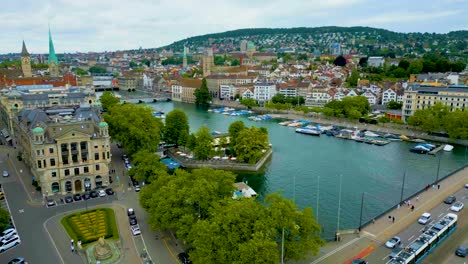 4k drone video of traffic on the quaibrücke bridge over the limmat river in downtown zurich, switzerland
