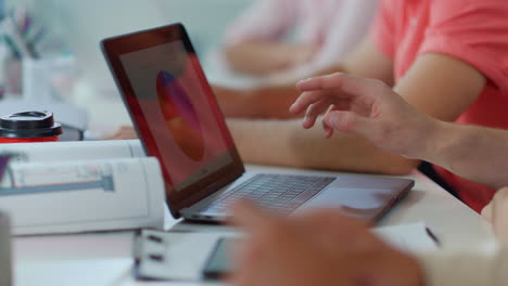 Male-hand-pointing-laptop-screen-in-office.-Unknown-man-working-computer-indoors