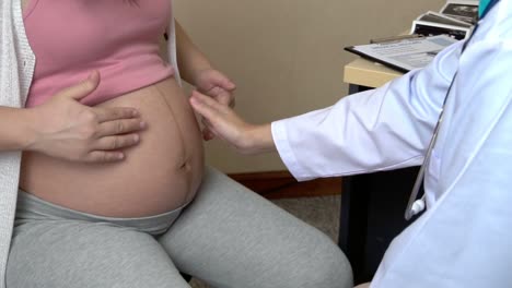 pregnant woman and gynecologist doctor at hospital