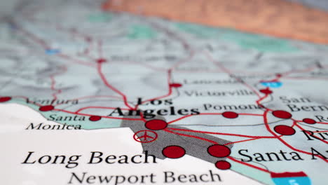 rack focus on fabric map showing los angeles and surrounding cities in california, usa. closeup shot, zoom-in