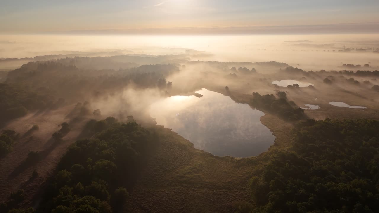 Misty Morning Landscape with Lakes and Forest at Sunrise