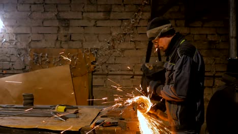 4 shots. blacksmith sawing metal with hand circular saw