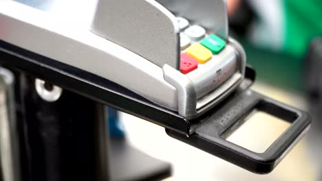 terminal for payment at supermarket close-up. contactless paying credit card 4k