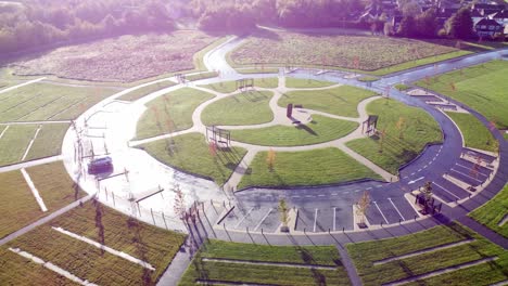 modern circular cemetery design aerial view artistic garden of rest orbit right above wet shining pathway